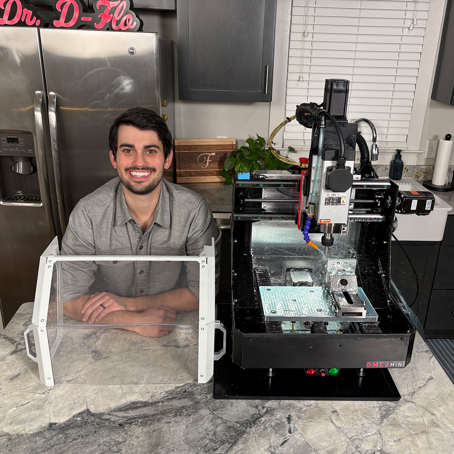 Dr. D-Flo next to the stock DMC2-Mini desktop milling machine