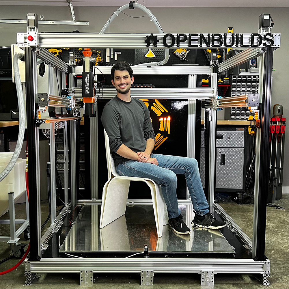 Sitting inside of Large Format 3D Printer on a 3D printed chair