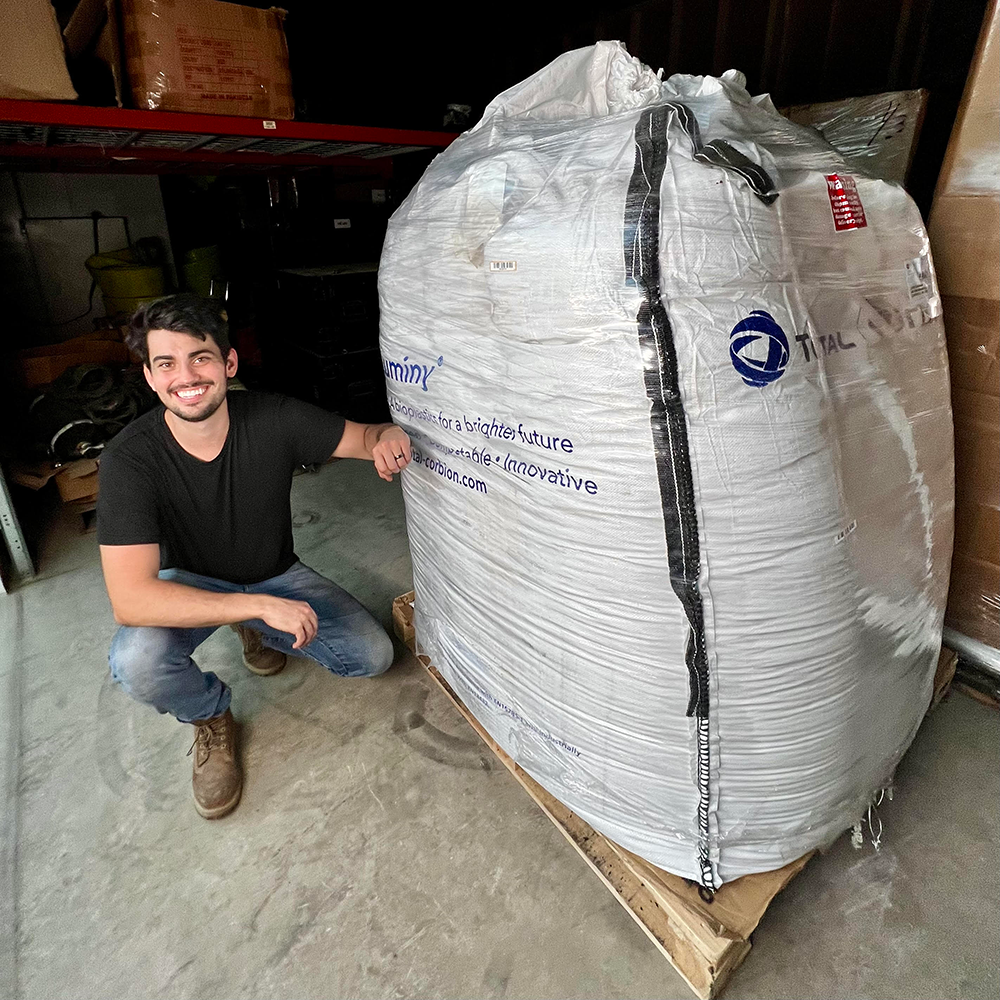 Dr. D-Flo next to a Supersack of PLA pellets for his Large Format 3D Printer