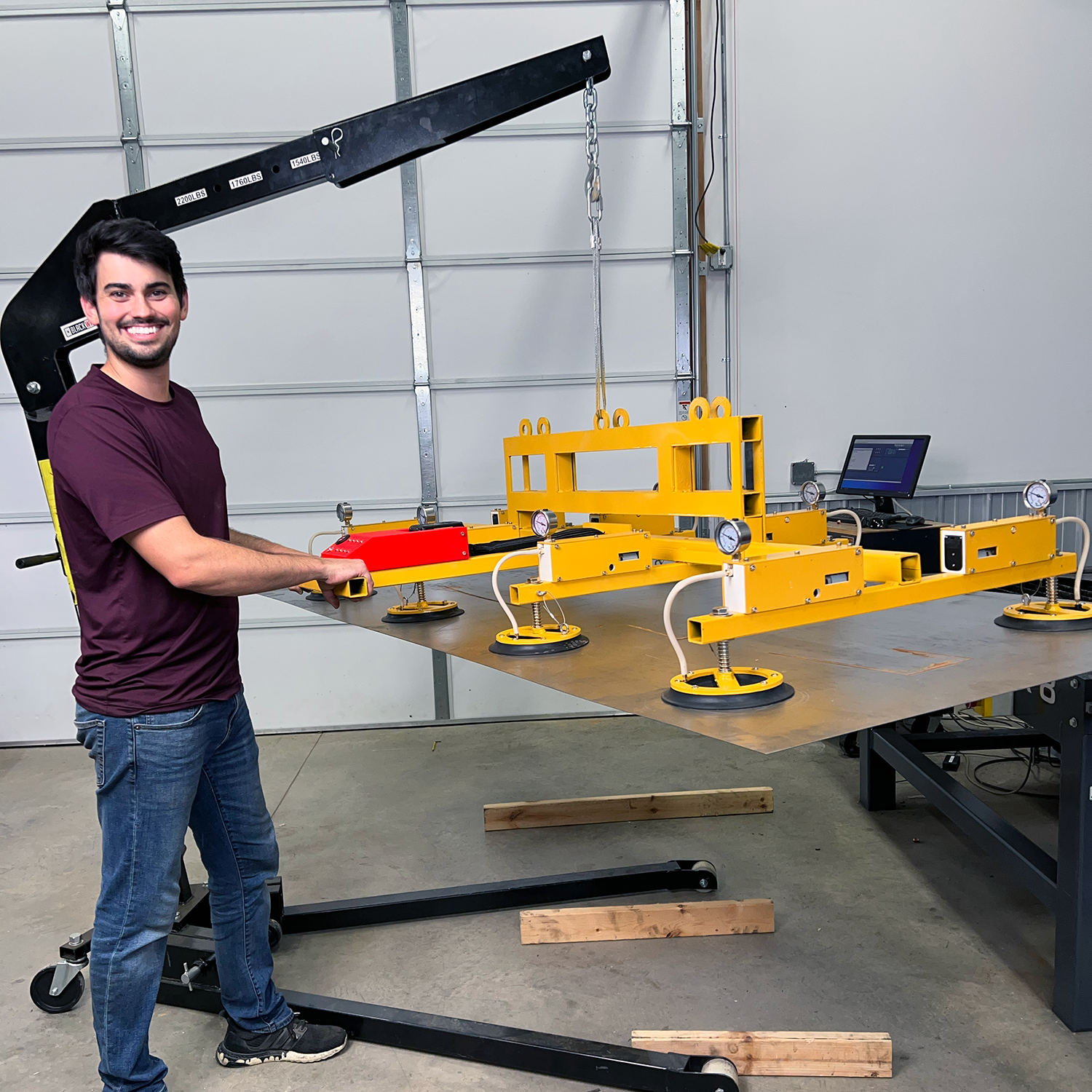 Dr. D-Flo using his DIY vacuum lifter for loading sheet metal onto his plasma table